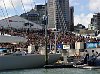 America's Cup 2003: A huge spectator fleet farewells Team New Zealand and Alinghi Swiss Challenge as they head to the racecourse on the first day of competition.