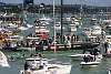 America's Cup 2003: A huge spectator fleet farewells Team New Zealand and Alinghi Swiss Challenge as they head to the racecourse on the first day of competition.