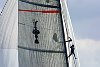 Murray Jones up the mast of Alinghi in search of breeze.