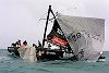 America's Cup Race 4: The crew struggle to haul the genoa back onboard so they work to dismantle the damaged rig.