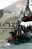 America's Cup Race 4: The knives are out as the mainsail is cut away.
