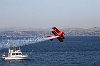 Sean D. Tucker, one of the Smithsonian Institute's 25 Living Legends of Flight, races over the Allianz Cup fleet in San Francisco Bay.