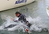 Triumphant skipper Ben Ainslie is tackled into the water by crewman Terry Hutchinson after winning the Allianz Cup 2006.