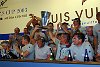 Alinghi wins the Louis Vuitton Cup let the celebrations begin<br><br>Post-win press conference -  Alinghi crew holds the Louis Vuitton Cup aloft.