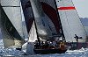 Oracle rounds the bottom mark right on the stern of Alinghi.