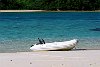 The Kingdom Of Tonga in the South Pacfic <br>Vava'u : A dinghy is beached on perfect white sand