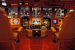  view from the wheel house of a super yacht with all of the instruments turned on.