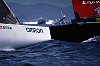The bow of Nippon powers off the start to weather of Young America. <br>America's Cup 2000