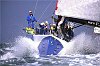 Steve Cotton trims the asymmetrical spinnaker on News Corp as they plane at speed off the Needles at the start of the 2001-2 Volvo Ocean Race.